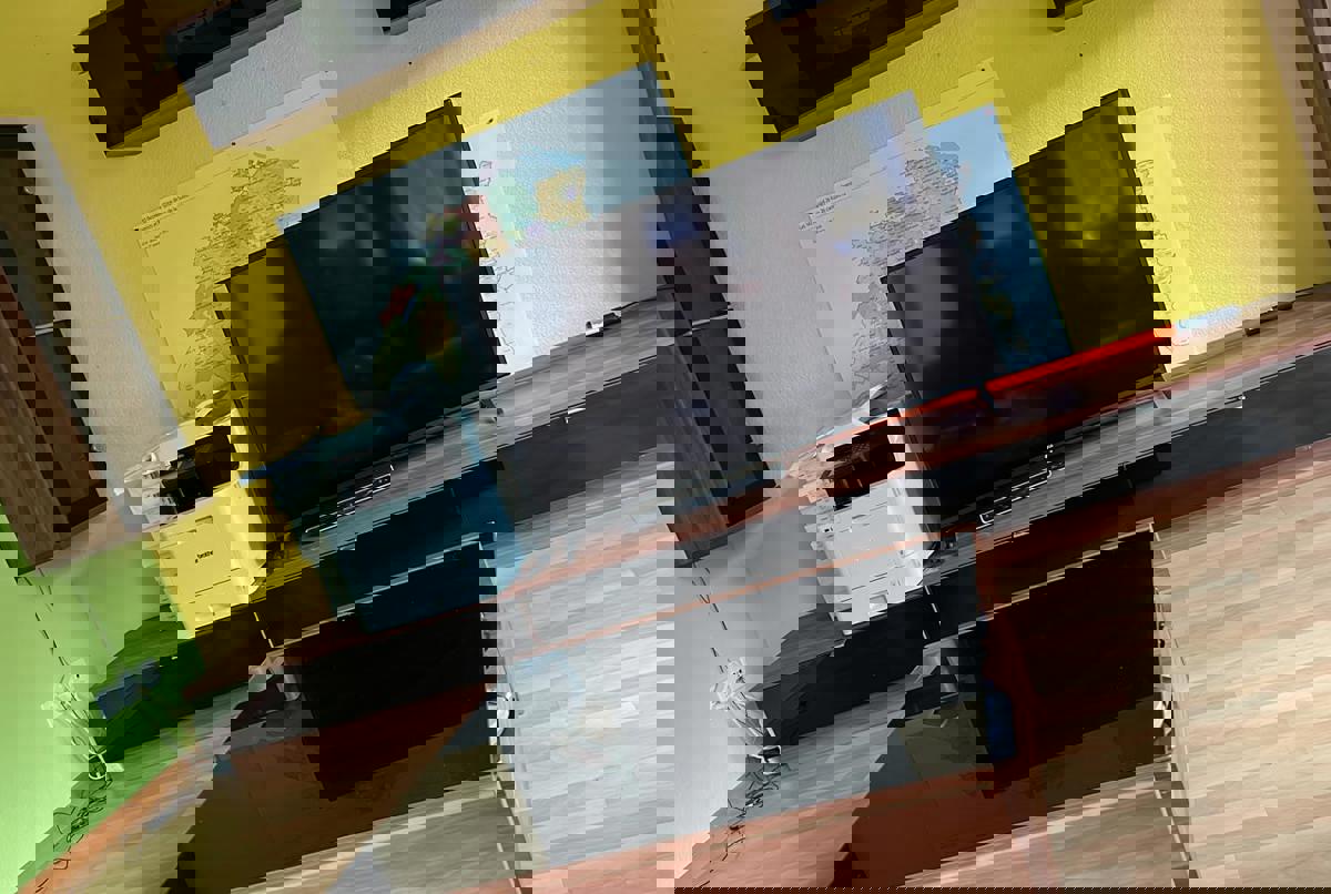 3 story house in a small town surrounded by nature