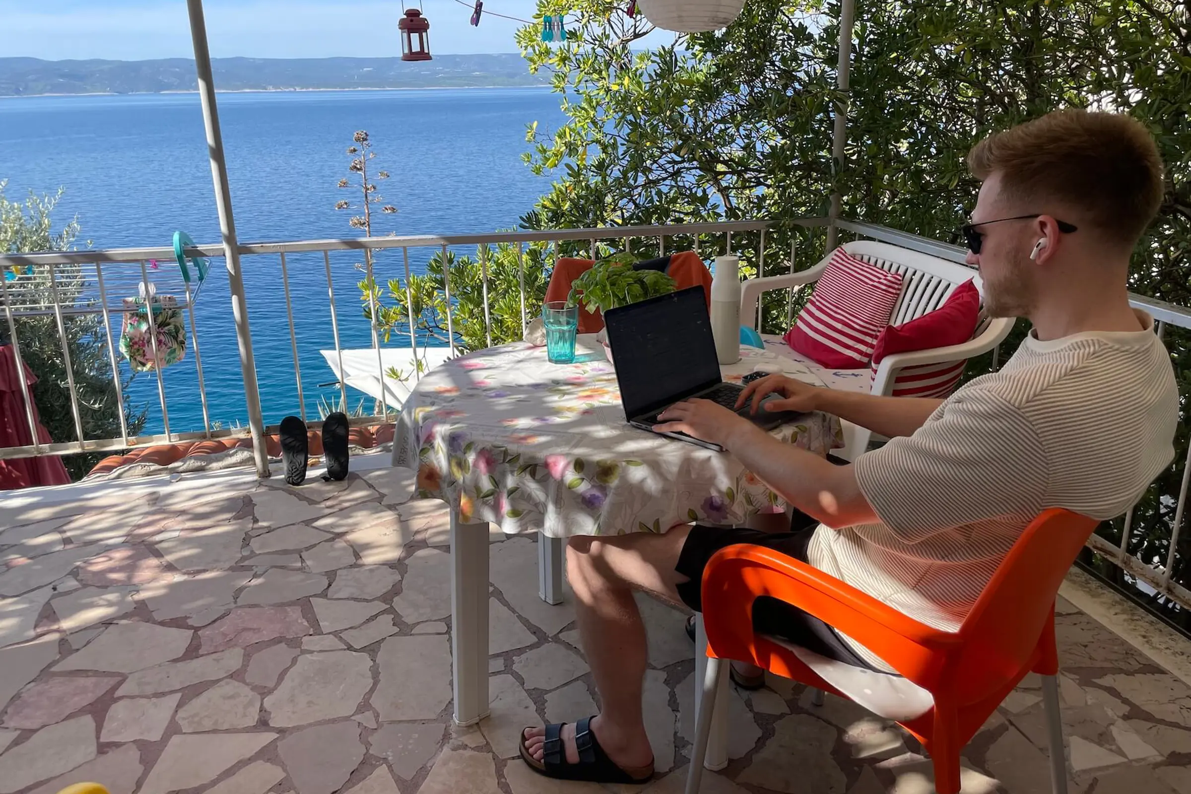 Tobi working remotely during a home swap