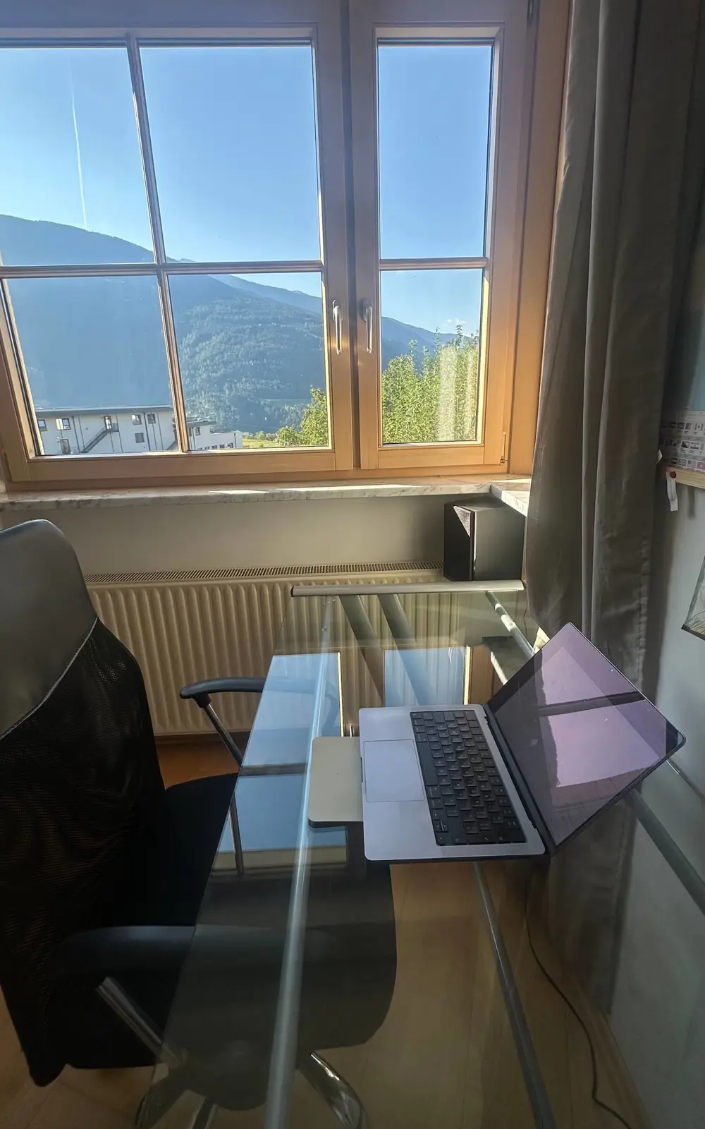 Remote workspace with view of Italian Alps during home swap